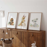 Australian animal nursery wall art set featuring a platypus, kangaroo and koala with joeys in soft neutral watercolour tones