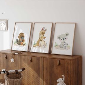Australian animal nursery wall art set featuring a platypus, kangaroo and koala with joeys in soft neutral watercolour tones