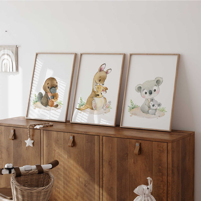 Australian animal nursery wall art set featuring a platypus, kangaroo and koala with joeys in soft neutral watercolour tones
