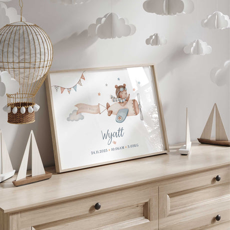 Aviation themed baby boy nursery wall art with bear in vintage plane