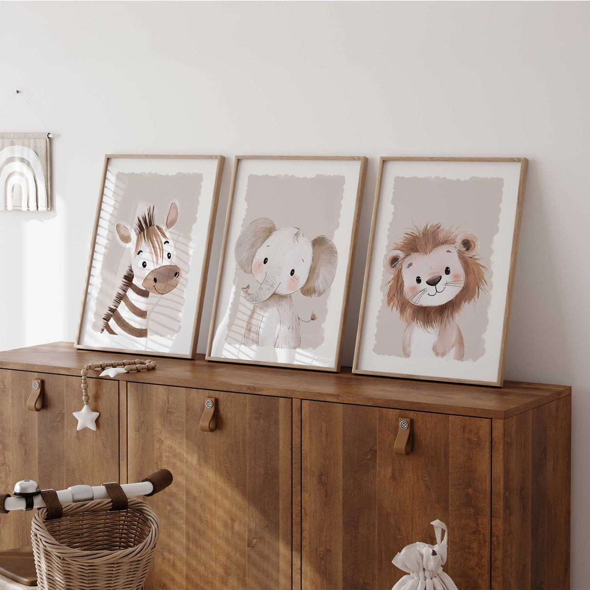 Baby animal nursery prints set with a lion, zebra and elephant in a soft neutral colour palette.