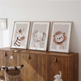 Baby animal nursery prints set with a lion, zebra and elephant in a soft neutral colour palette.