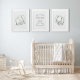 Set of three boys elephant wall art prints in soft grey and blue tones for nursery styling.