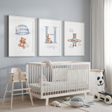 Blue teddy bear nursery prints with a parachute bear, personalised initial and name, and bear flying a plane.