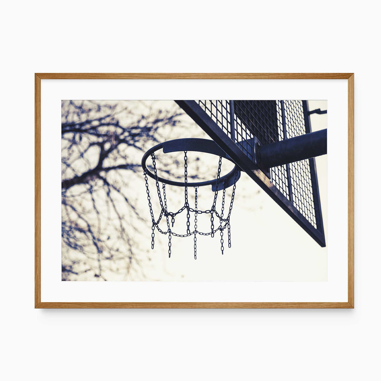 minimalist basketball hoop wall art with chain net and neutral sky background