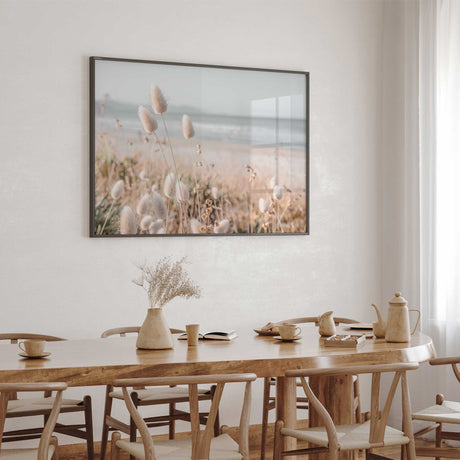 Beach grass photography wall print with soft coastal reeds and ocean scenery in a light neutral palette