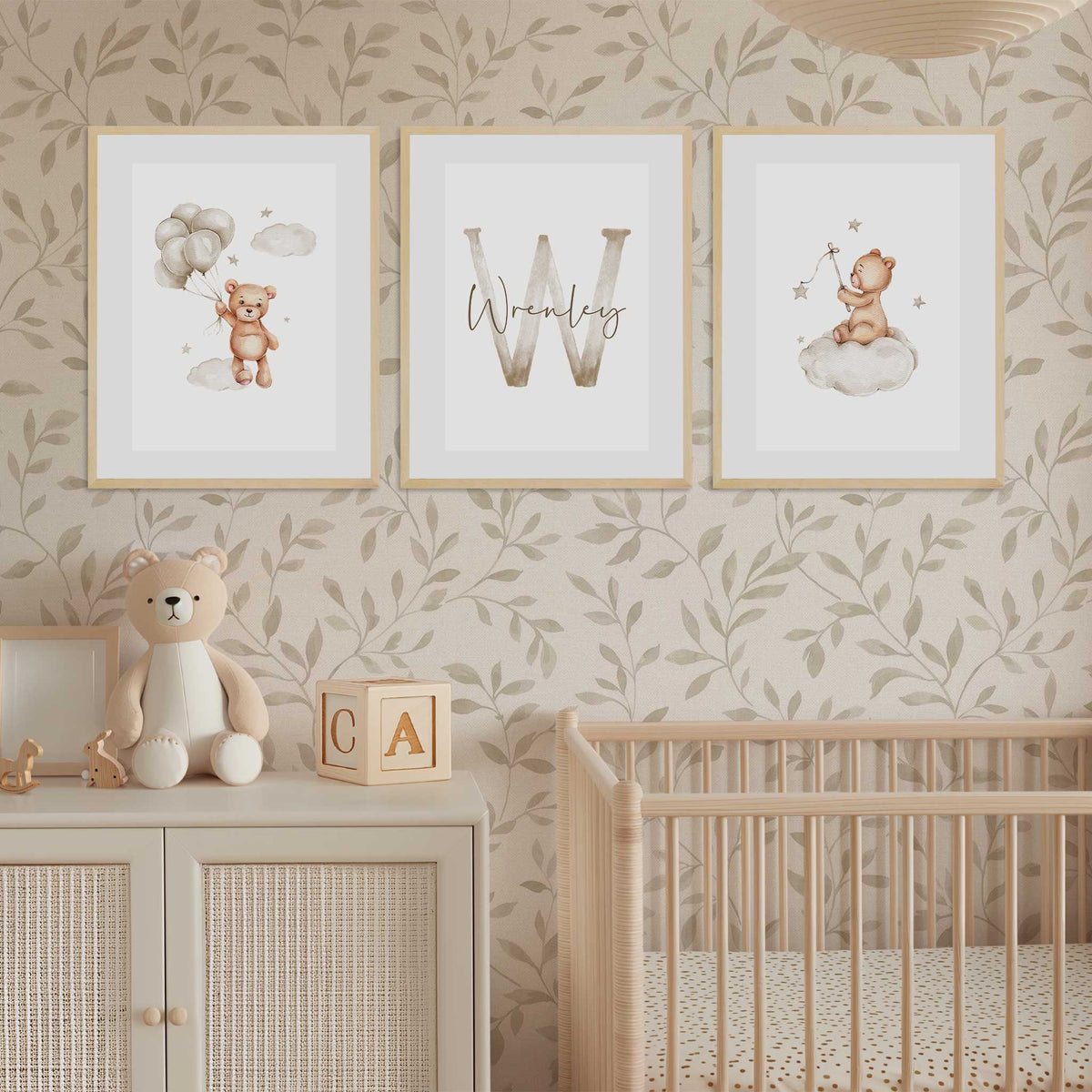 The prints feature a teddy bear with balloons, a large letter initial with the childs name in script, and a teddy bear sitting on a cloud.
