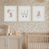 The prints feature a teddy bear with balloons, a large letter initial with the childs name in script, and a teddy bear sitting on a cloud.
