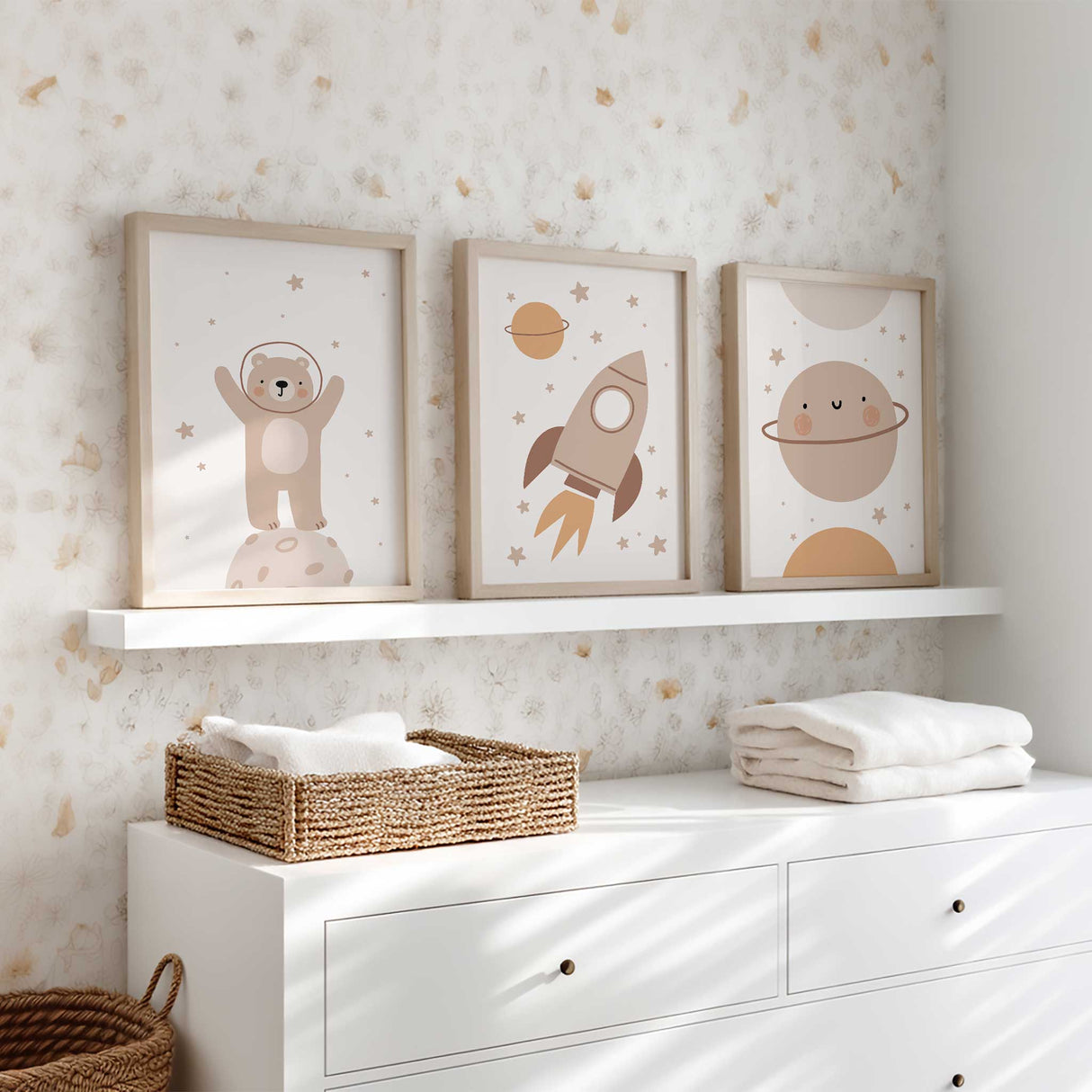 Kids space wall art set with rocket, bear astronaut and planet illustrations in warm neutral colours for nursery decor