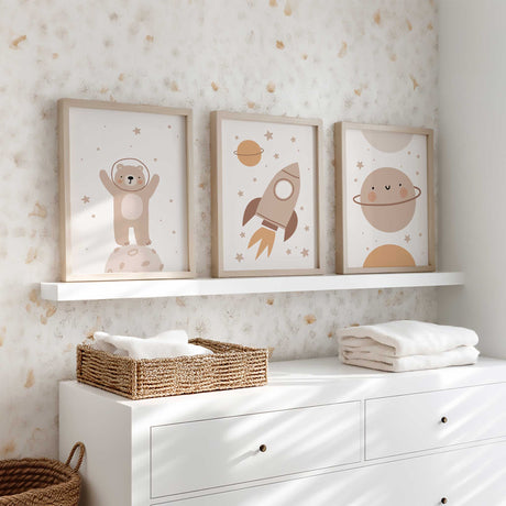 Kids space wall art set with rocket, bear astronaut and planet illustrations in warm neutral colours for nursery decor