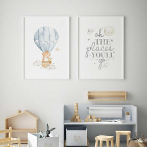 Soft blue hot air balloon nursery print featuring bear and bunny in the sky