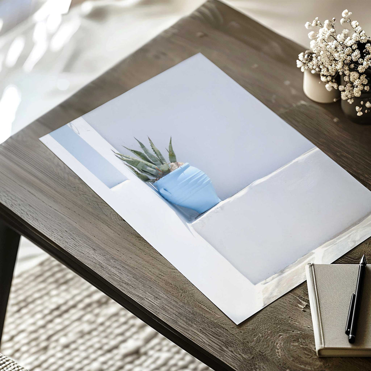 Mediterranean photographic print featuring a small blue plant pot on a ledge against a whitewashed wall