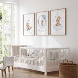 Blue teddy bear nursery wall art set with balloon bear, moon bear and cloud bear prints in soft watercolour tones for baby boy room decor