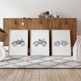 Three vintage toy car prints in muted blue tones, with watercolour ride-on cars numbered 1 to 3 on white backgrounds.