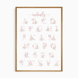 Blush pink floral letter decorated with soft pastel flowers and gold style accents on a white background