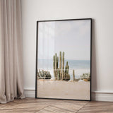 Boho coastal wall art showing cactus plants in sandy beach setting