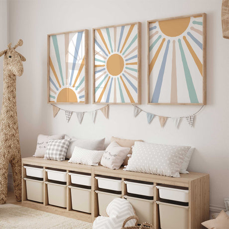 Three boho sun prints with mustard yellow suns and radiating blue, mint green and beige rays on white backgrounds.