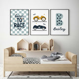 Race car wall art set with Born to Race lettering, mustard and navy cars, and a patterned initial with kids name.