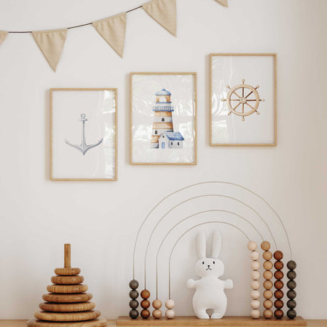 Boys' bedroom wall art set with nautical anchor, lighthouse, and ship wheel prints