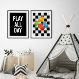 Kids playroom wall art set featuring a play all day quote print and colourful building block artwork on a black and white checkered background