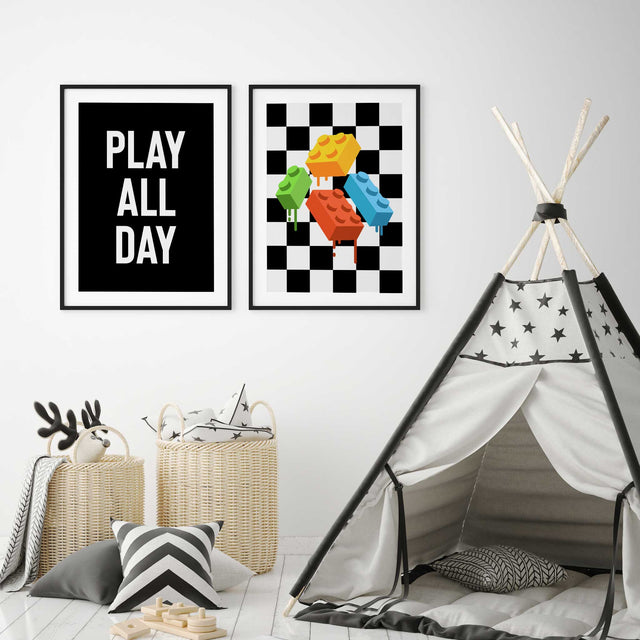 Kids playroom wall art set featuring a play all day quote print and colourful building block artwork on a black and white checkered background