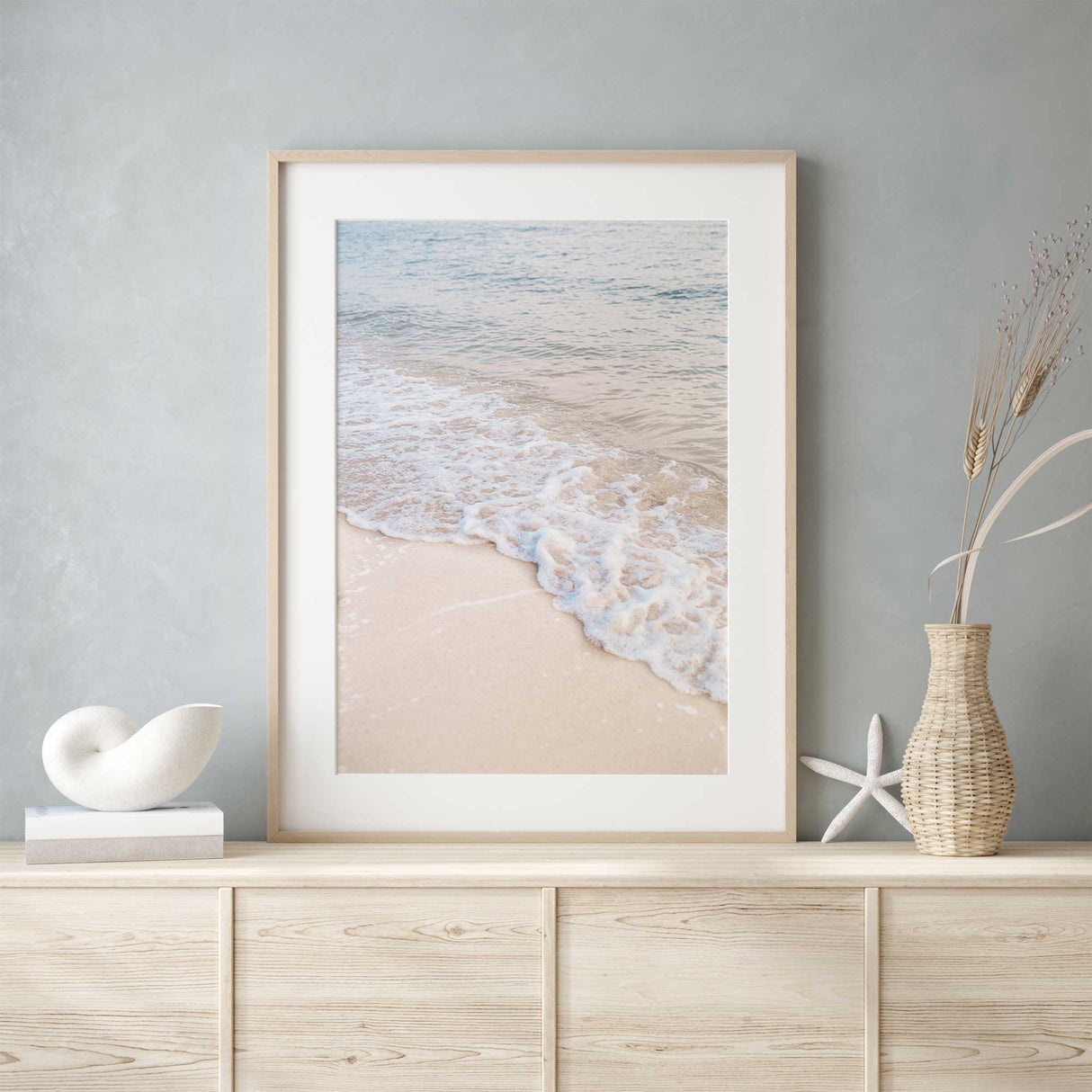 calming coastal ocean wall art featuring soft waves and sandy beach
