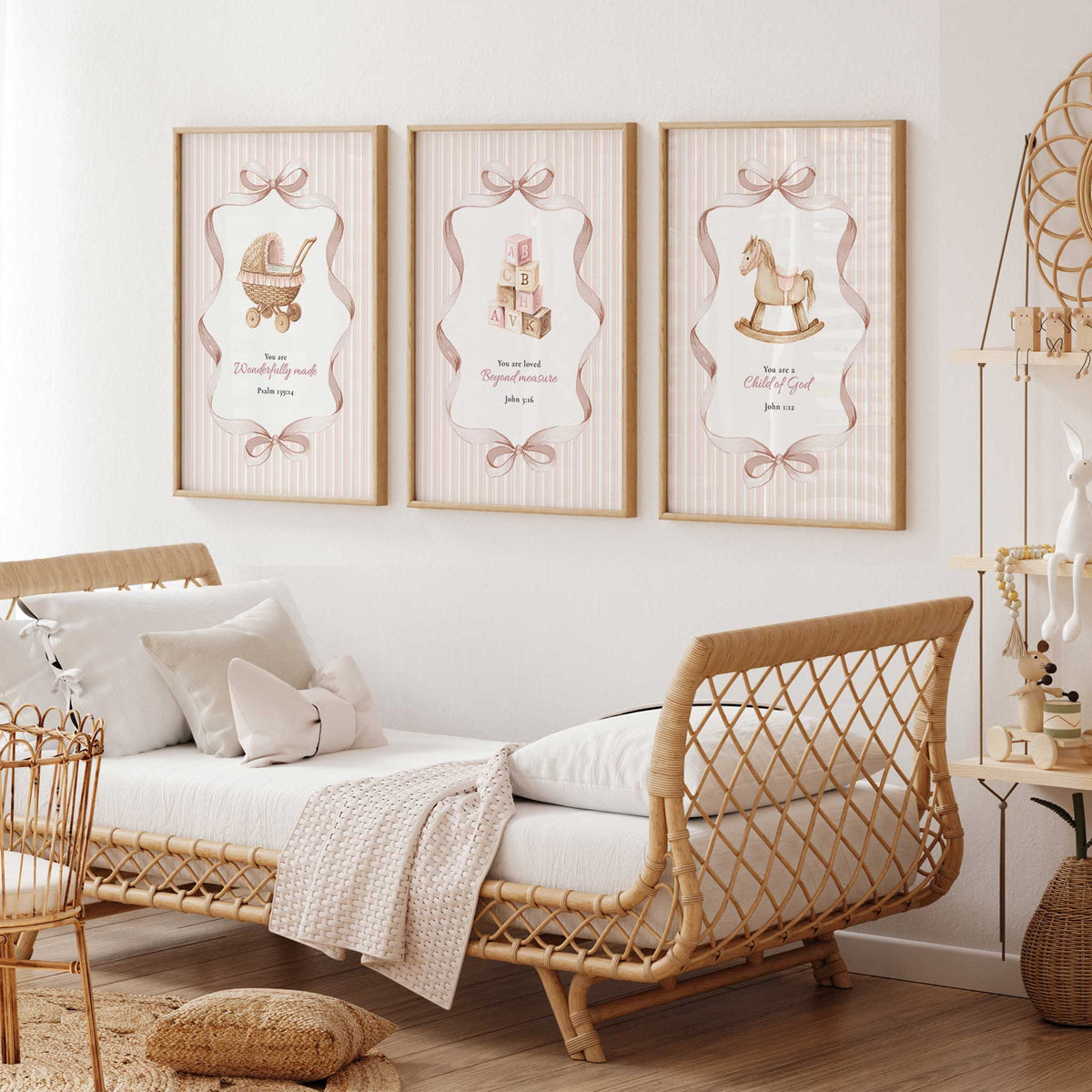 Christian Bible verse prints displayed in a girls room with soft pink stripes, bow details and vintage illustrations