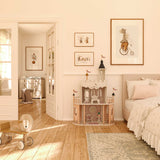 Set of circus animal gallery wall prints featuring juggling mice, giraffe, and elephant in warm neutral tones.