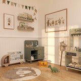 Circus gallery wall art prints arranged in a set of four with playful illustrated animals in soft tones.