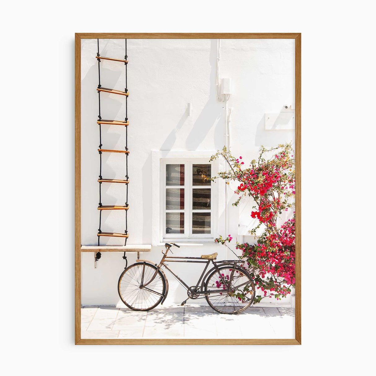 Coastal travel wall art featuring a vintage bicycle beside bright bougainvillea