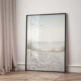 Soft neutral coastal seascape wall print with ocean shoreline, beach grasses and peaceful sky for modern coastal interior styling