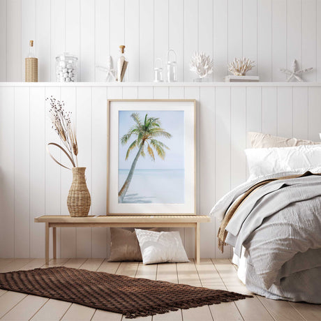 Coastal palm tree wall art print with blue ocean horizon and white sand beach