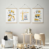 Three yellow construction vehicle prints featuring a cement mixer, dump trucks, diggers and a Build Your Dreams crane.