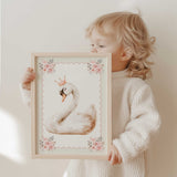 White swan with a blush crown, pink floral corners, a scalloped pink outline and a fine sage green striped border.