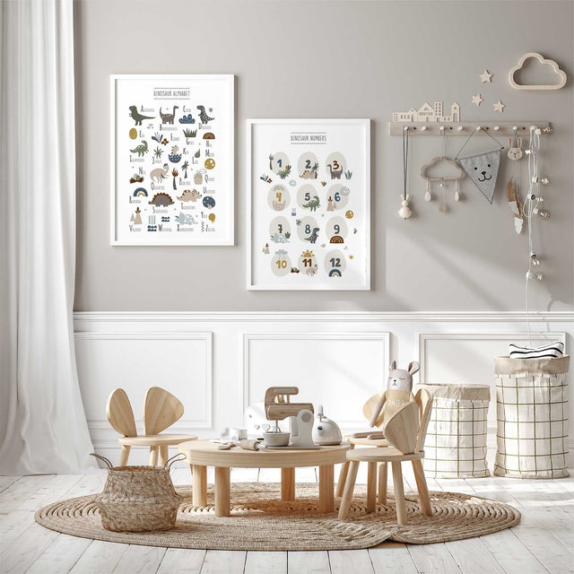Two dinosaur prints showing an illustrated A–Z alphabet and numbers 1–12 in a matching earthy colour palette