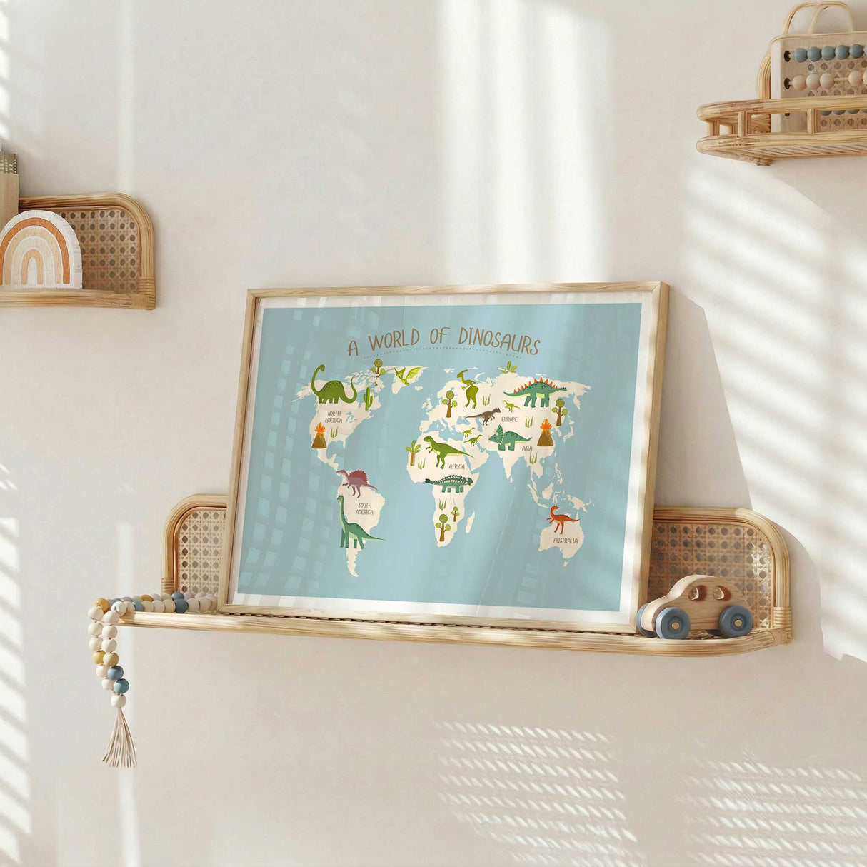 Boys dinosaur bedroom print with playful dinosaurs, volcanoes, trees and a pale blue map background.