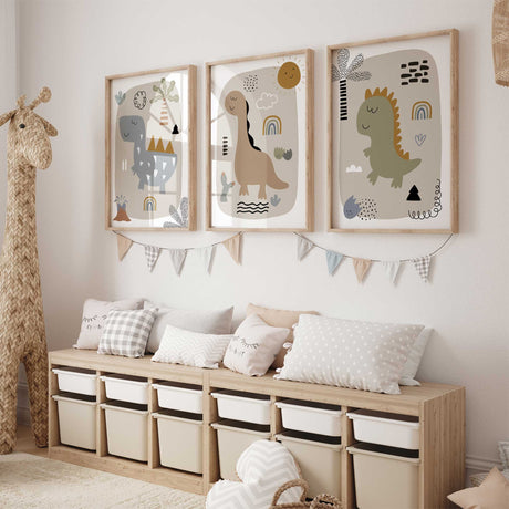 Dinosaur print trio featuring a blue-grey plated dinosaur, tan long-neck dinosaur and olive dinosaur with mustard spikes.