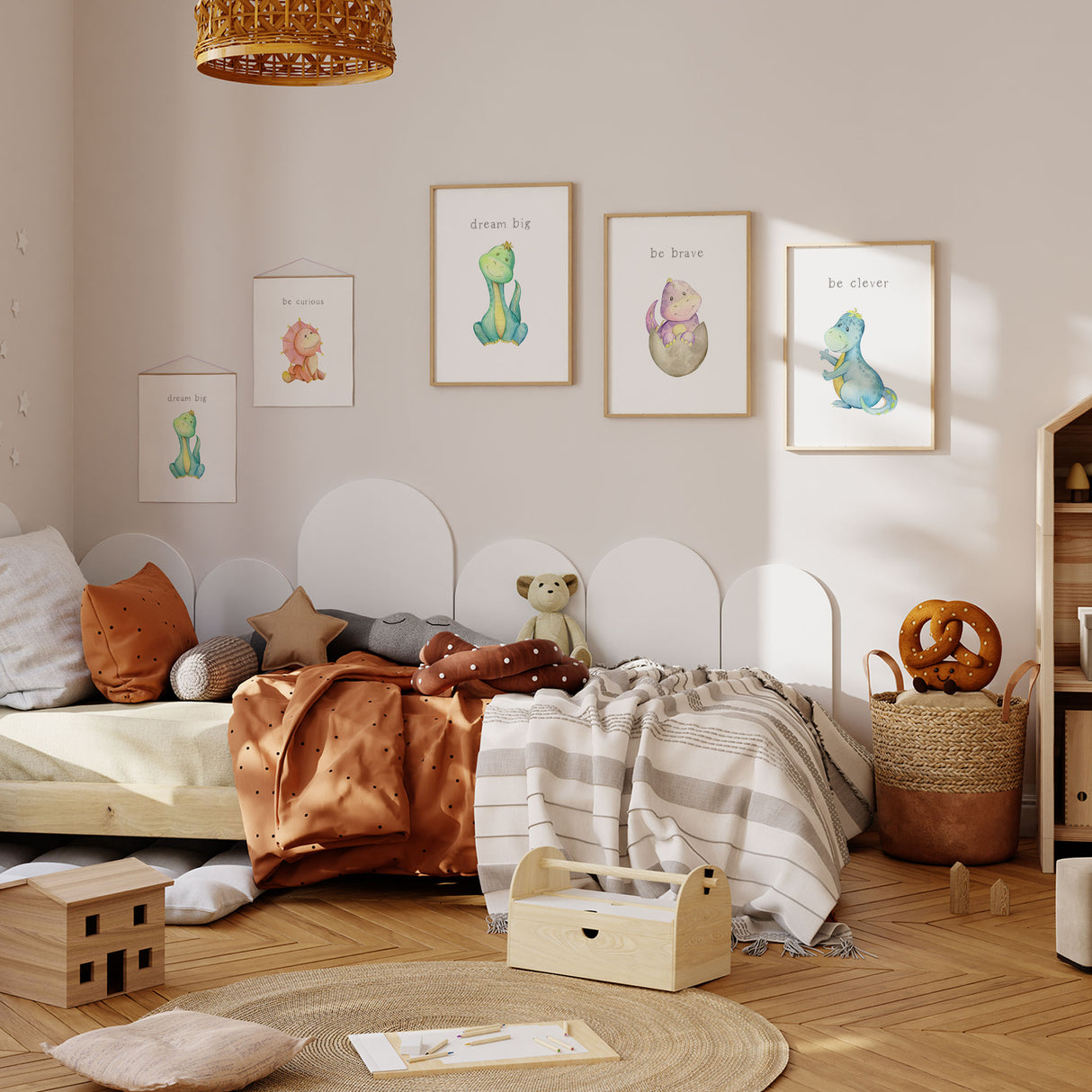 Dinosaur nursery wall art set with colourful dino prints and positive quote art including dream big, be brave and be clever in soft pastel tones