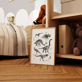 Dinosaur wall art print with labelled black and white dinosaurs and soft green leaves