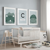 Dinosaur wall art set of three featuring cute dinosaur illustrations and a personalised initial name print in soft green tones