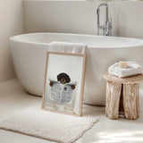 Humorous image of a dog on a toilet, holding a newspaper with a white bathroom background.