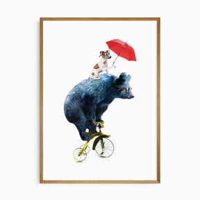A poster depicting a cartoon bear riding a yellow tricycle with a dog wearing sunglasses and holding a red umbrella, all against a white background.