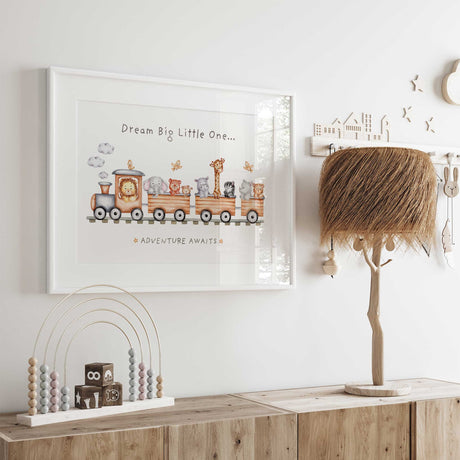 Dream Big Little One lettering above a watercolour train carrying safari animals in this single nursery art print