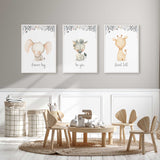 Elephant zebra and giraffe nursery prints in soft neutral tones