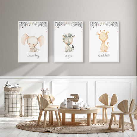 Elephant zebra and giraffe nursery prints in soft neutral tones