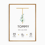 Eucalyptus baby name print with a gold-toned initial, watercolour leaves and personalised newborn birth details