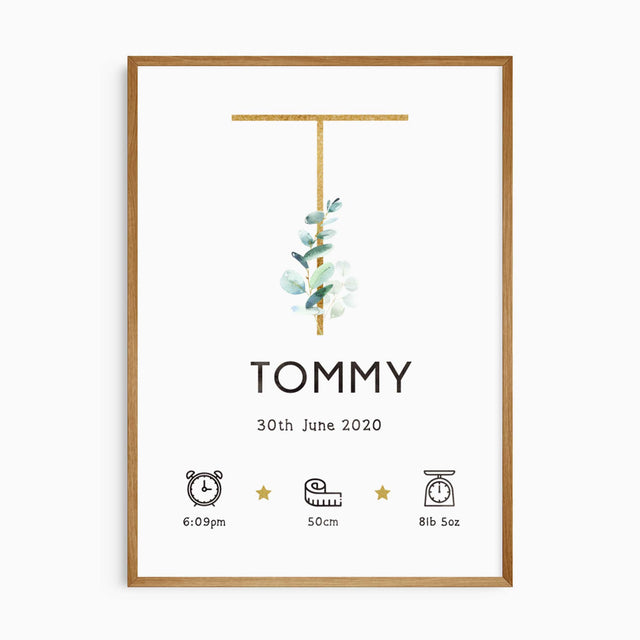 Eucalyptus baby name print with a gold-toned initial, watercolour leaves and personalised newborn birth details