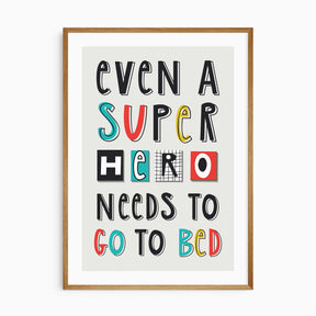 Fun kids wall art with “Even a Superhero Needs to Go to Bed” text in colourful typography.