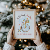Detail of the Christmas bicycle illustration with a bird, wrapped presents and soft blue background on the family names print