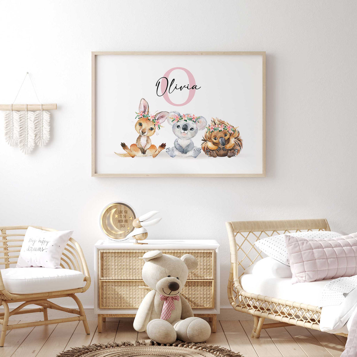 Name print with a pink initial above a kangaroo, koala and echidna, each wearing a pink and green flower crown.